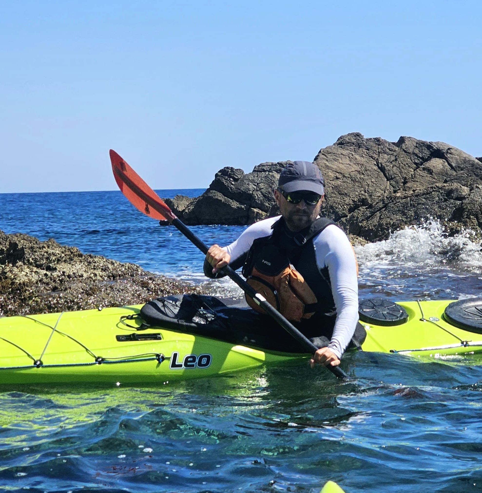 Kayak guide in sit-in kayak