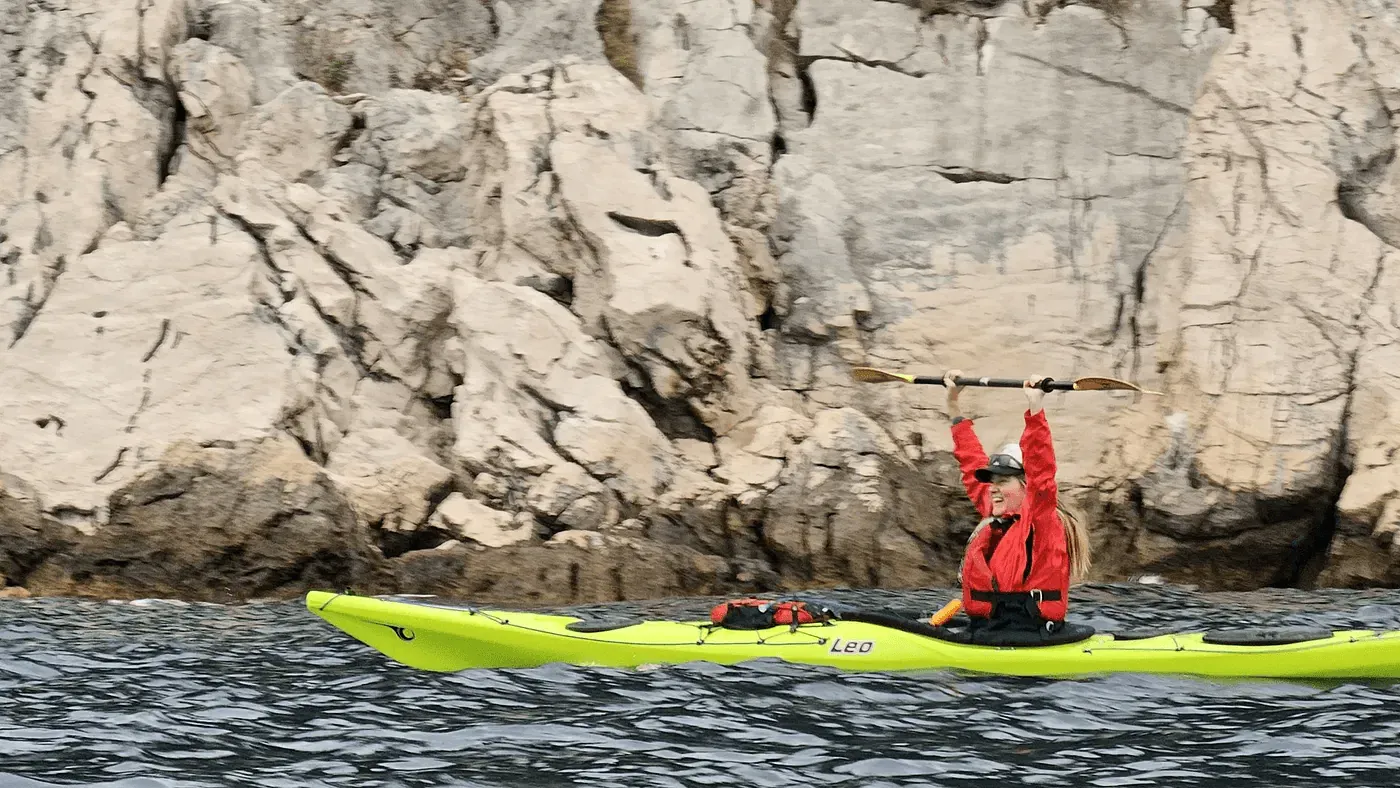 Sea kayakers paddling along the Elaphiti islands coastline