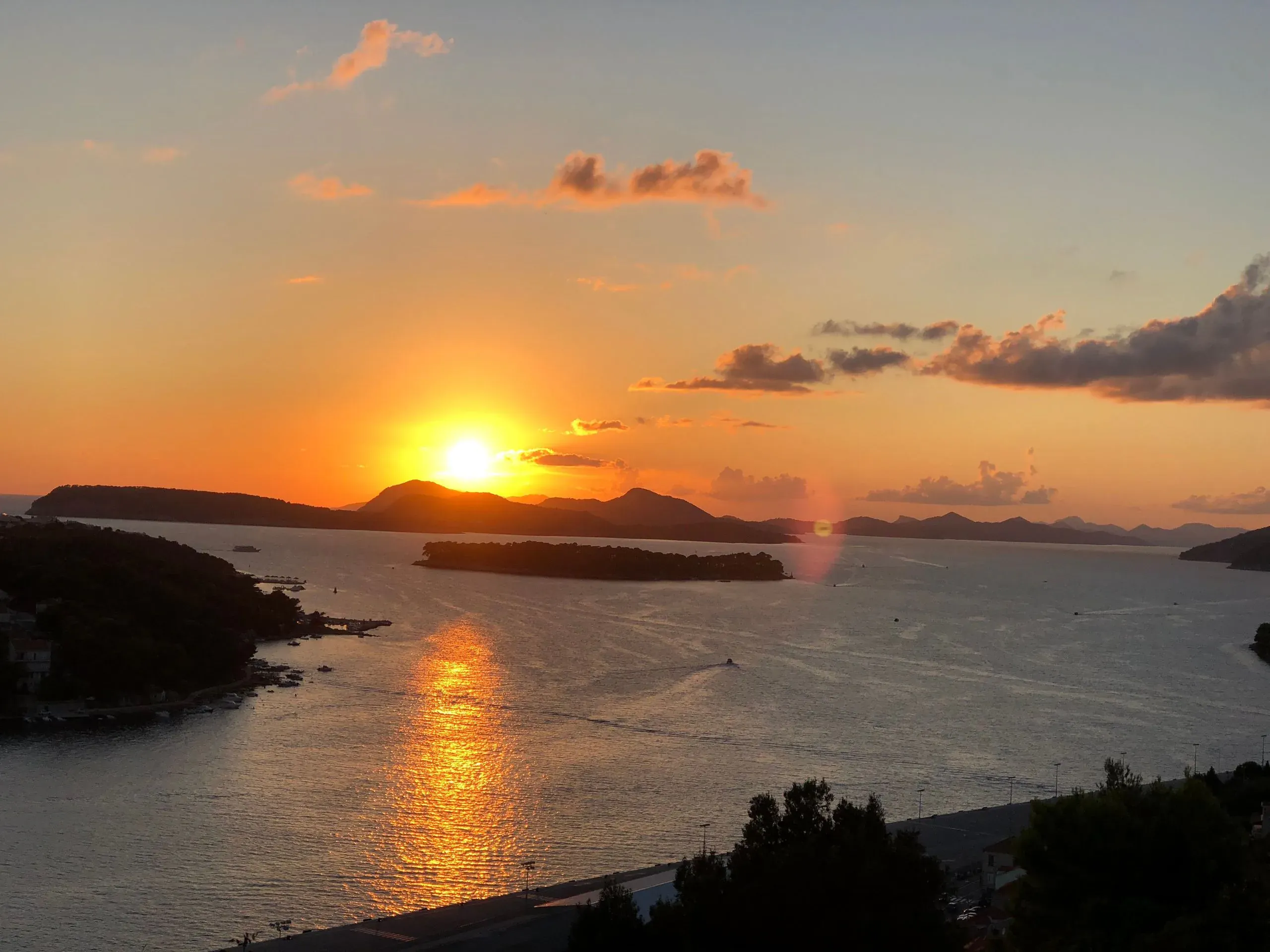 Sunset over the Elaphiti islands seen across a calm sea